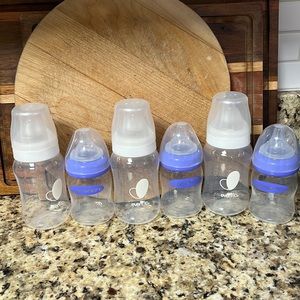 3 Evenflo balance + and 3 Lansinoh wide nipple bottles.
